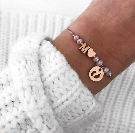 Personalisiertes Armband Babyfüße lila rosé gold