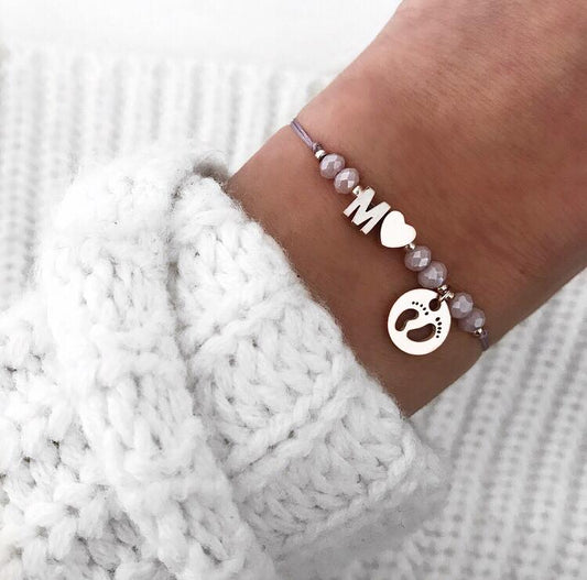 Personalisiertes Armband Babyfüße lila silber