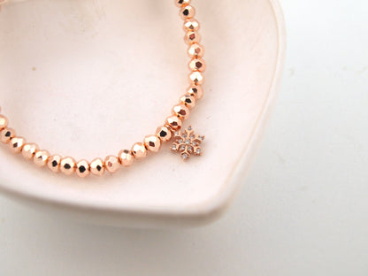 Perlenarmband Schneeflocke